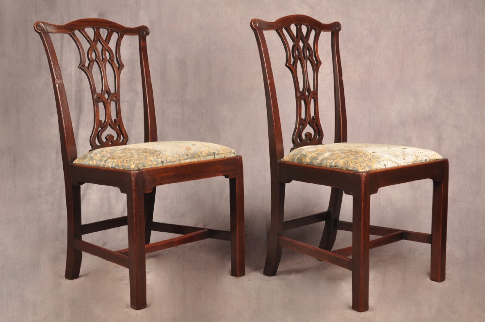 A set of six mahogany Chippendale style dining chairs featuring intricate pierced back splats and patterned upholstered drop-in seats. View III