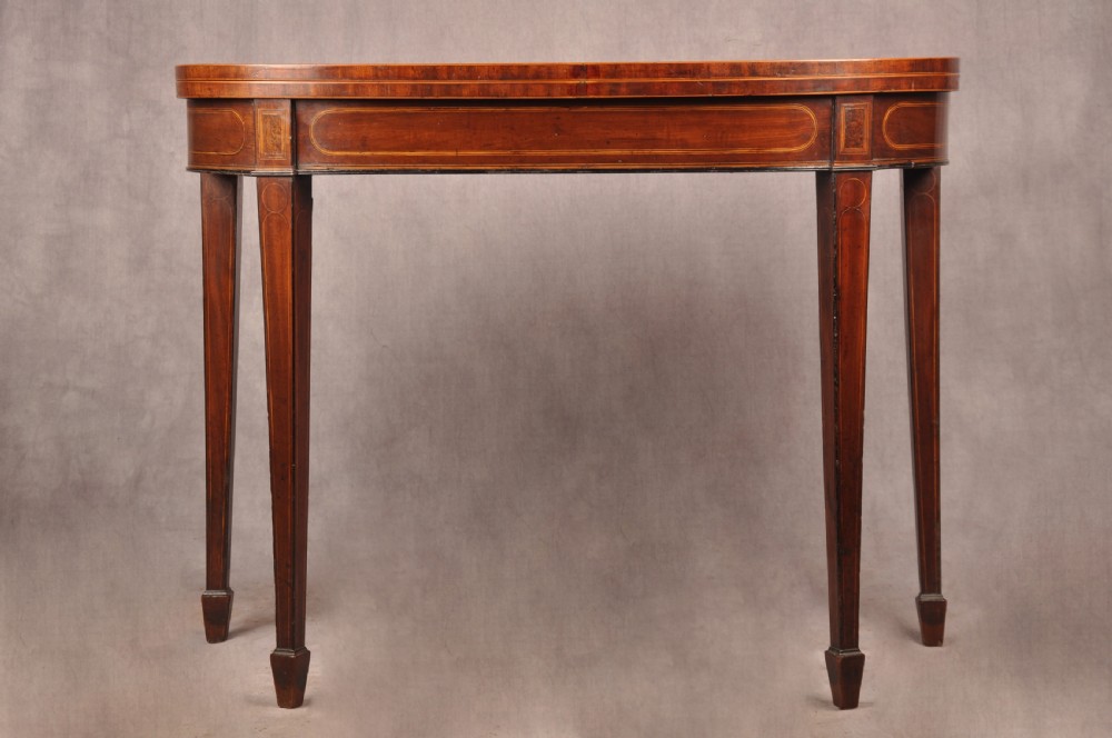 An 18th-century demilune card table featuring a geometric parquetry top, inlaid apron, and four square tapered legs ending in spade feet. View III