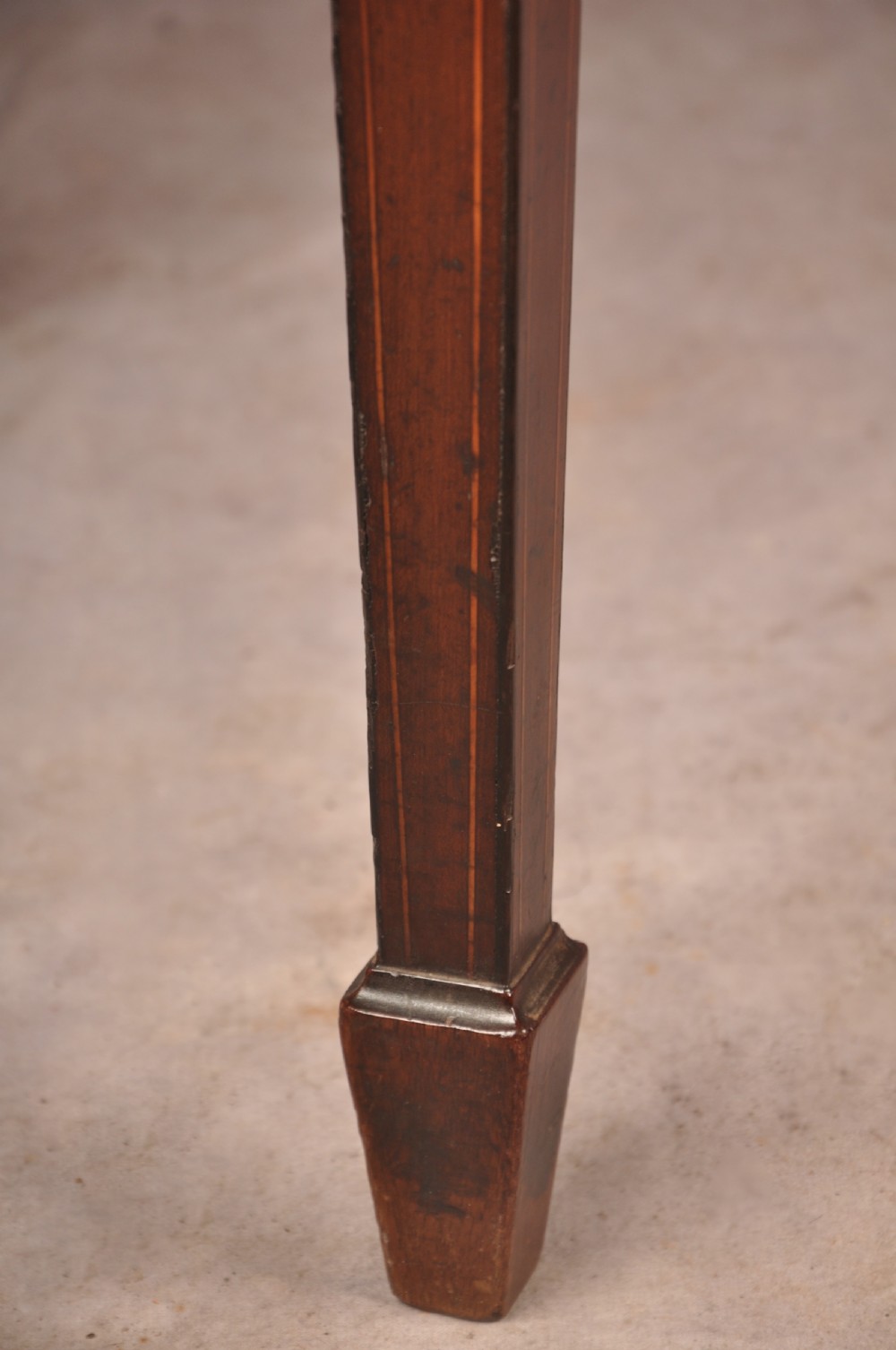 An 18th-century demilune card table featuring a geometric parquetry top, inlaid apron, and four square tapered legs ending in spade feet. View VII