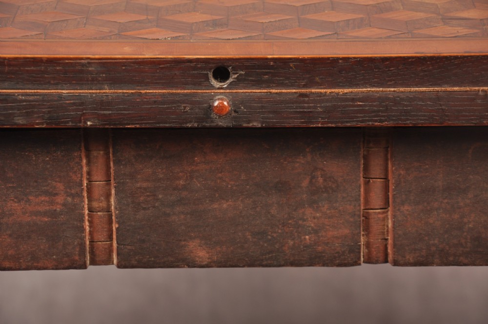 An 18th-century demilune card table featuring a geometric parquetry top, inlaid apron, and four square tapered legs ending in spade feet. View X