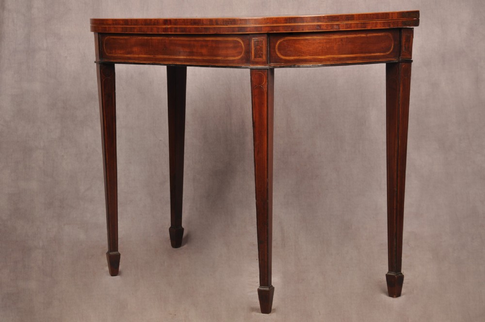 An 18th-century demilune card table featuring a geometric parquetry top, inlaid apron, and four square tapered legs ending in spade feet. View XIII