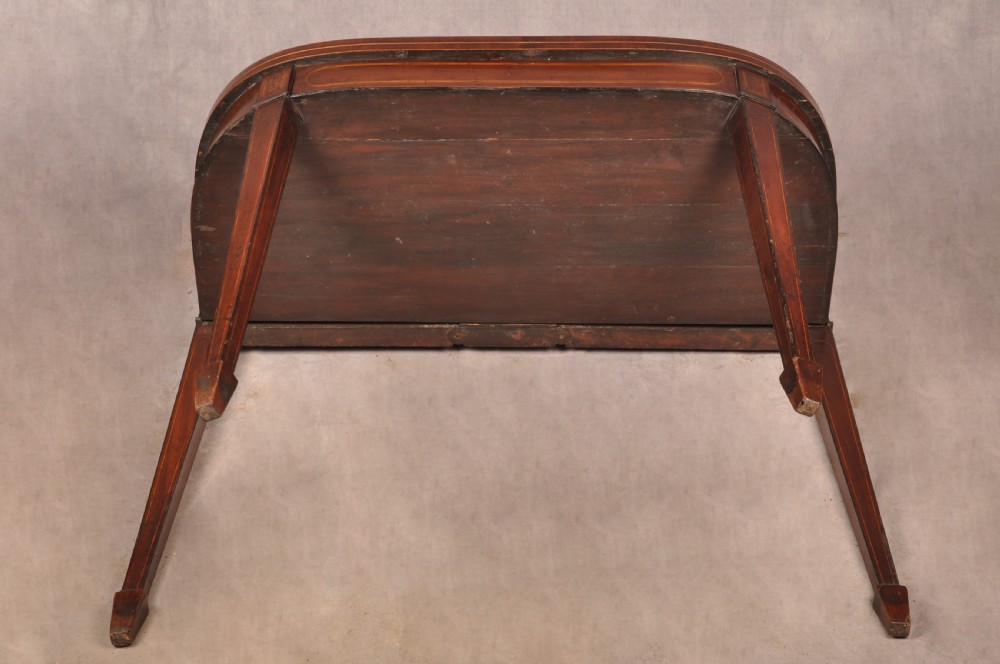 An 18th-century demilune card table featuring a geometric parquetry top, inlaid apron, and four square tapered legs ending in spade feet. View XX
