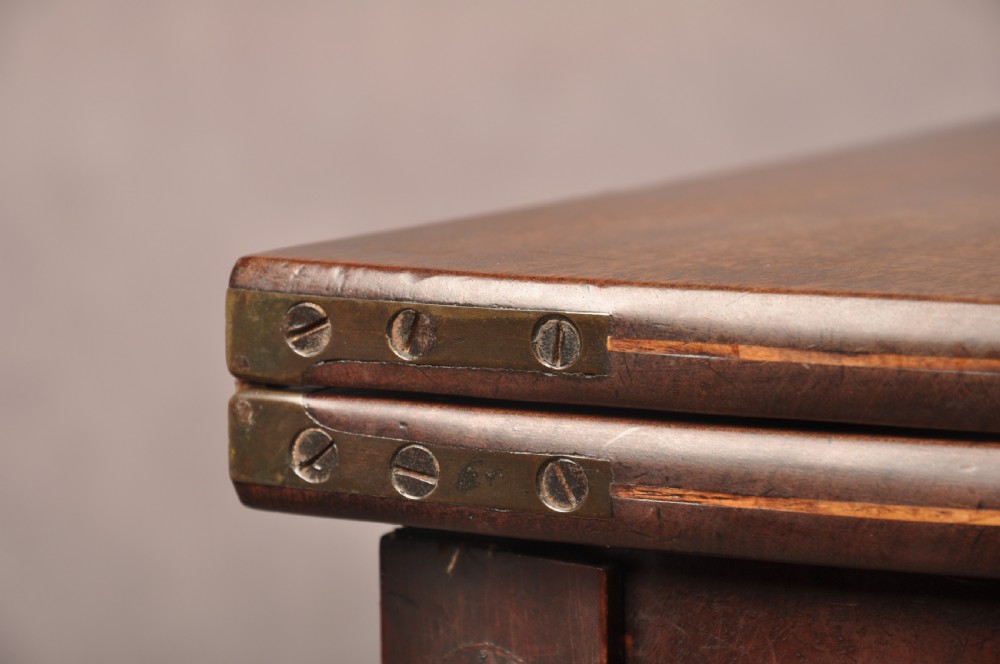 An 18th-century demilune mahogany tea table featuring tapered legs with inlaid patera motifs and spade feet. View XI