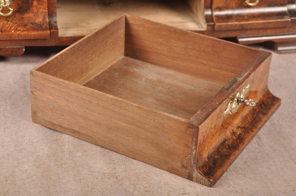 An 18th-century walnut toilet mirror featuring a rectangular adjustable glass frame resting above a three-drawer box base with brass handles. View XI