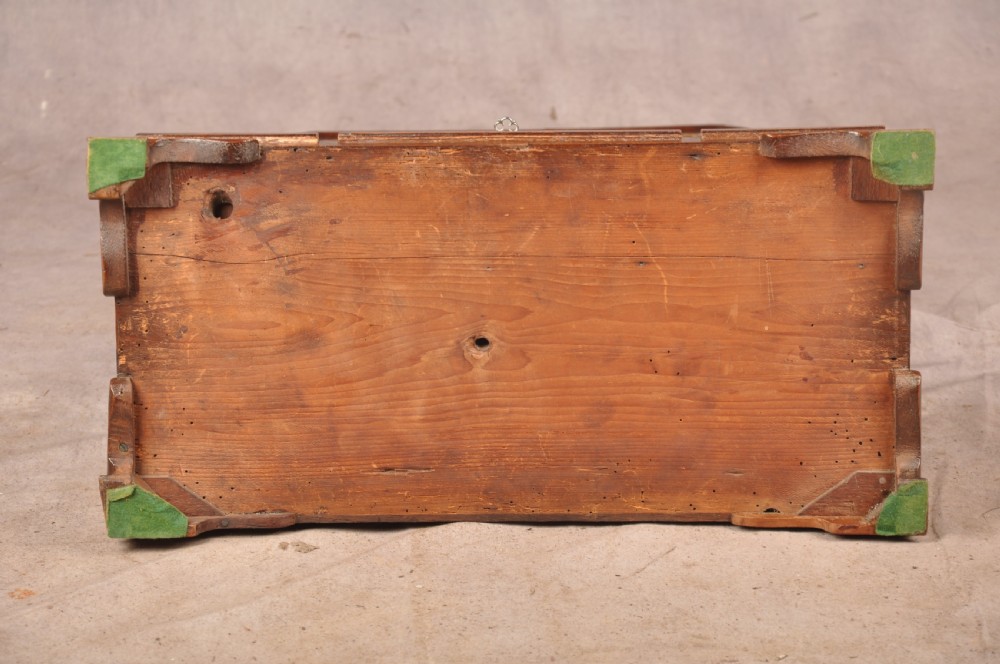An 18th-century walnut toilet mirror featuring a rectangular adjustable glass frame resting above a three-drawer box base with brass handles. View XVII