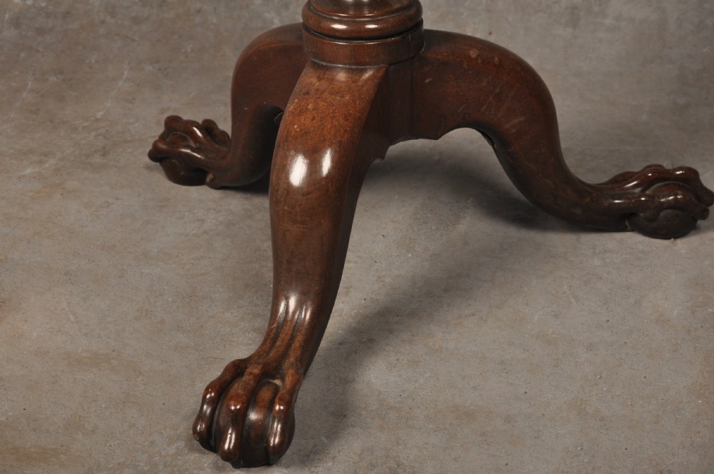 An 18th-century mahogany tripod table featuring a circular scalloped piecrust top, a turned column, and three cabriole legs ending in carved feet. View II