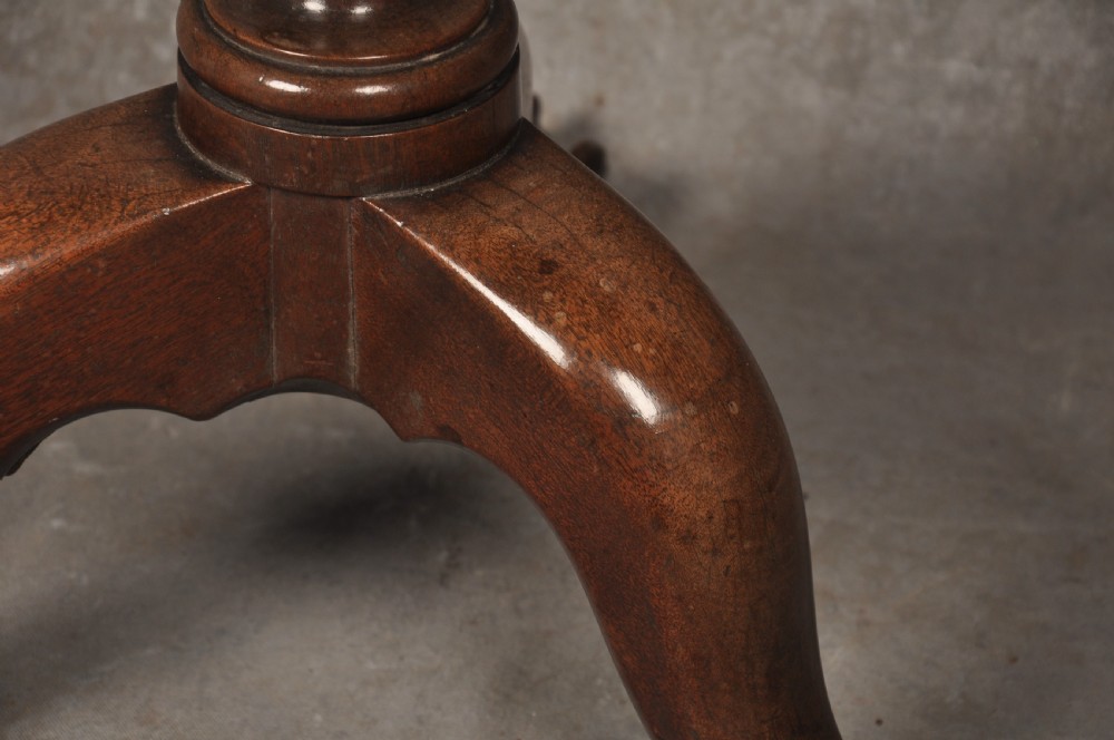 An 18th-century mahogany tripod table featuring a circular scalloped piecrust top, a turned column, and three cabriole legs ending in carved feet. View III