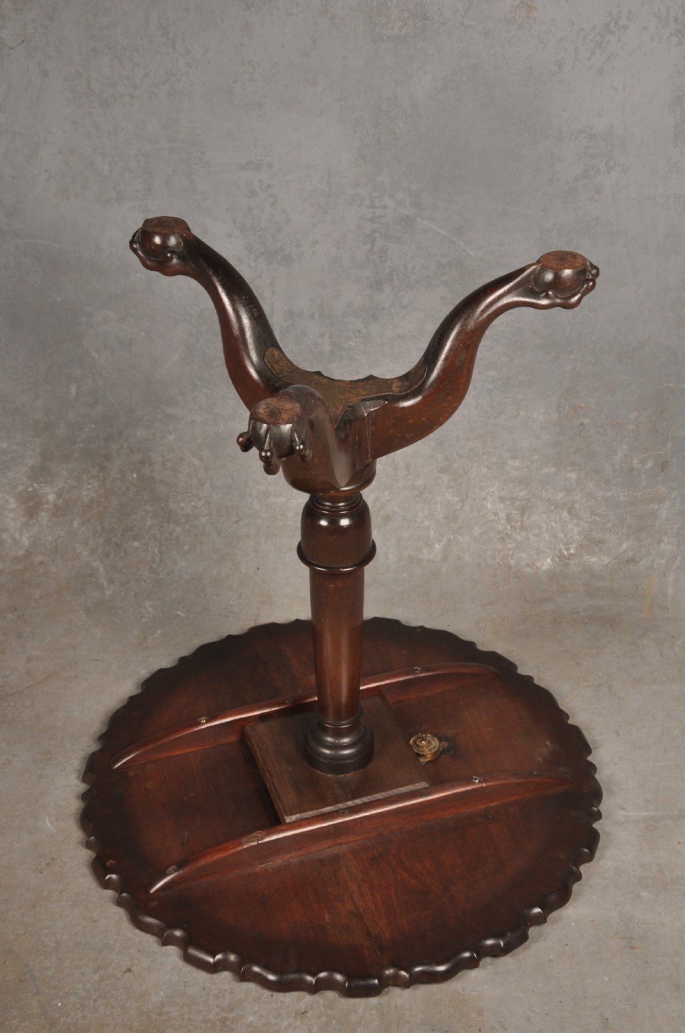 An 18th-century mahogany tripod table featuring a circular scalloped piecrust top, a turned column, and three cabriole legs ending in carved feet. View VIII