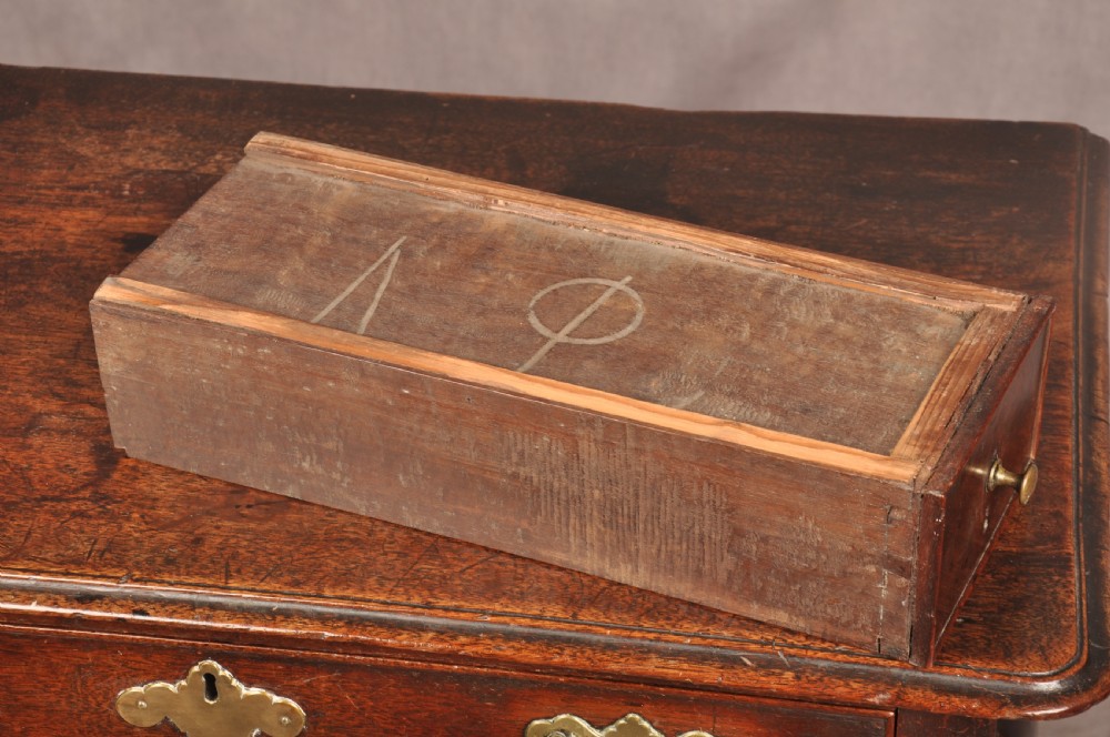 An early 18th-century dark walnut lowboy side table featuring cabriole legs with pad feet, three brass-handled drawers, and a shaped apron. View X