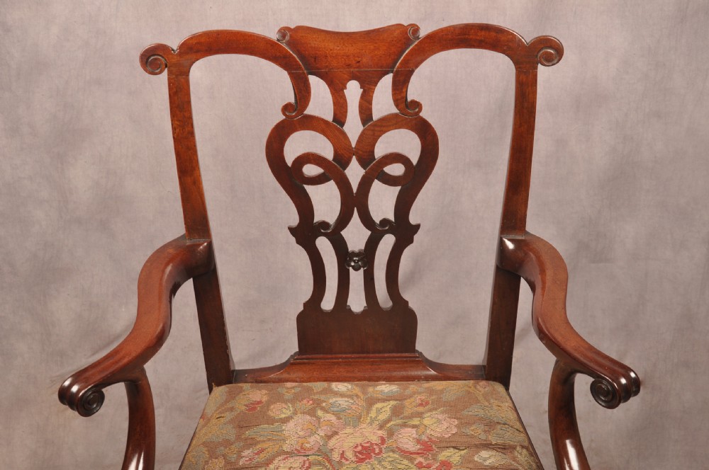 An 18th-century mahogany armchair with a carved pierced splat back, shaped arms, a tapestry-upholstered seat, and cabriole front legs ending in ball and claw feet. View VII