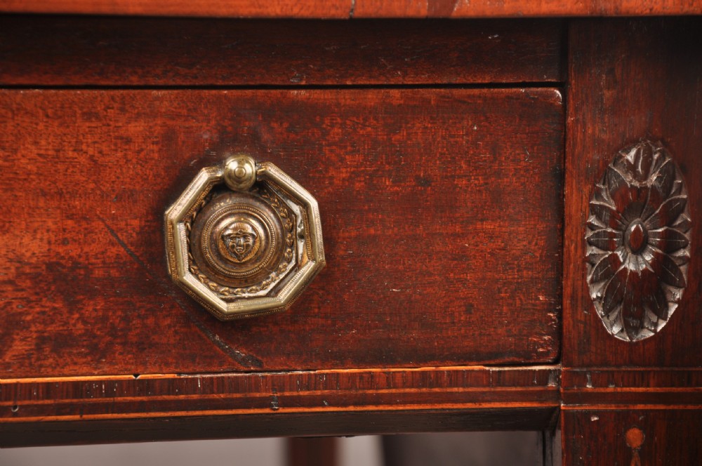 A late 18th-century mahogany Pembroke table with drop-leaf sides, square tapered legs on castors, and a single drawer with octagonal brass handles. View IV