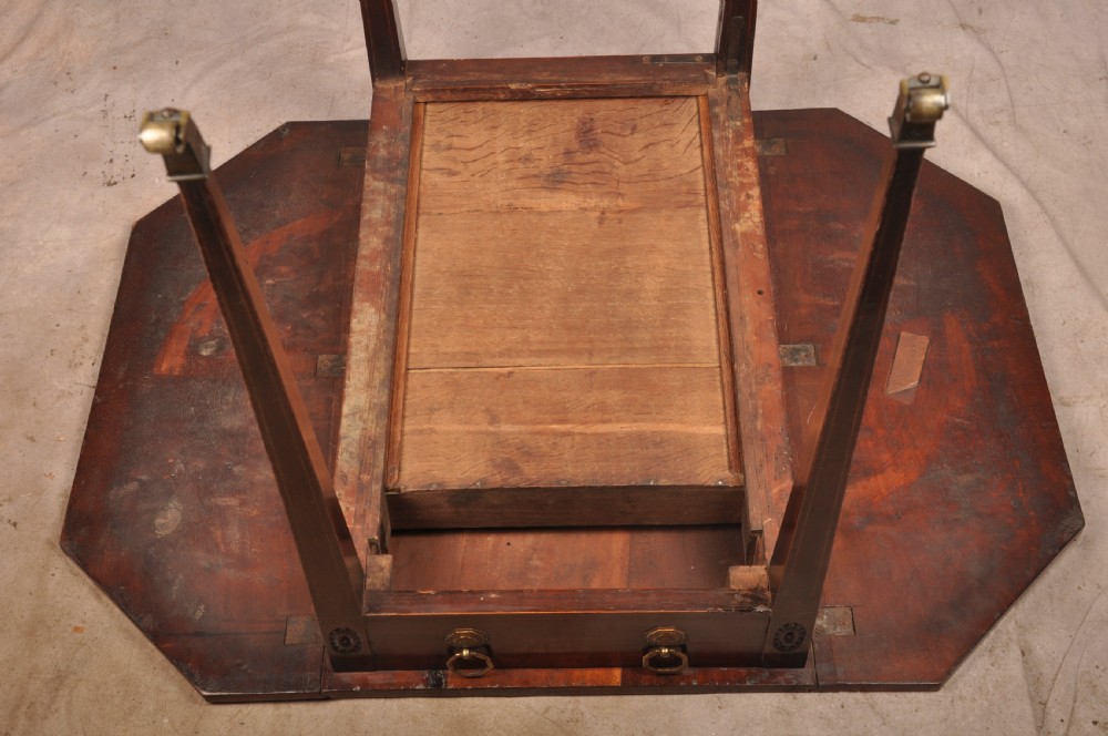 A late 18th-century mahogany Pembroke table with drop-leaf sides, square tapered legs on castors, and a single drawer with octagonal brass handles. View X