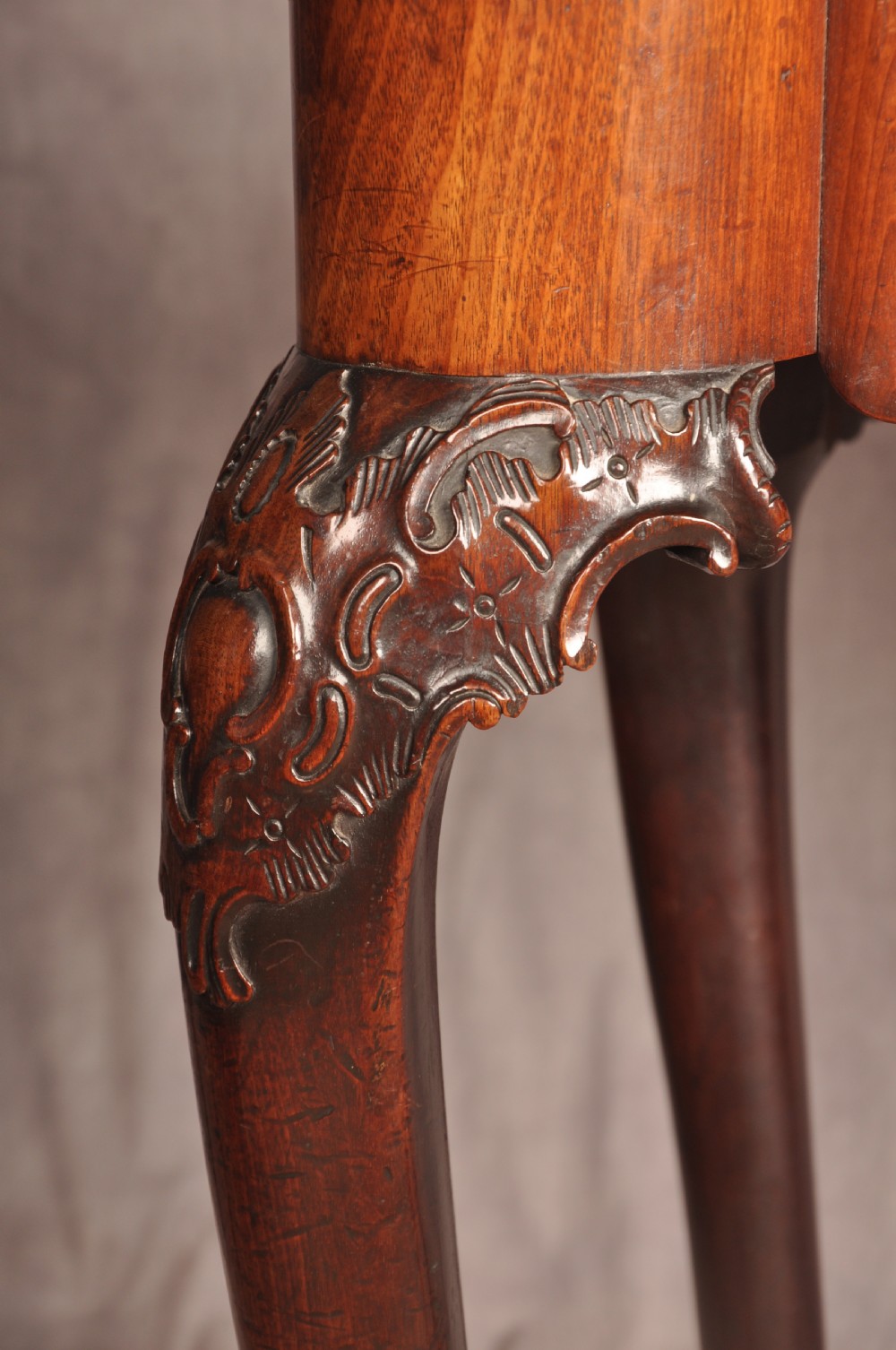 An 18th-century George II mahogany card table with a fold-over shaped top, a frieze drawer, and carved cabriole legs with claw-and-ball feet. View VI