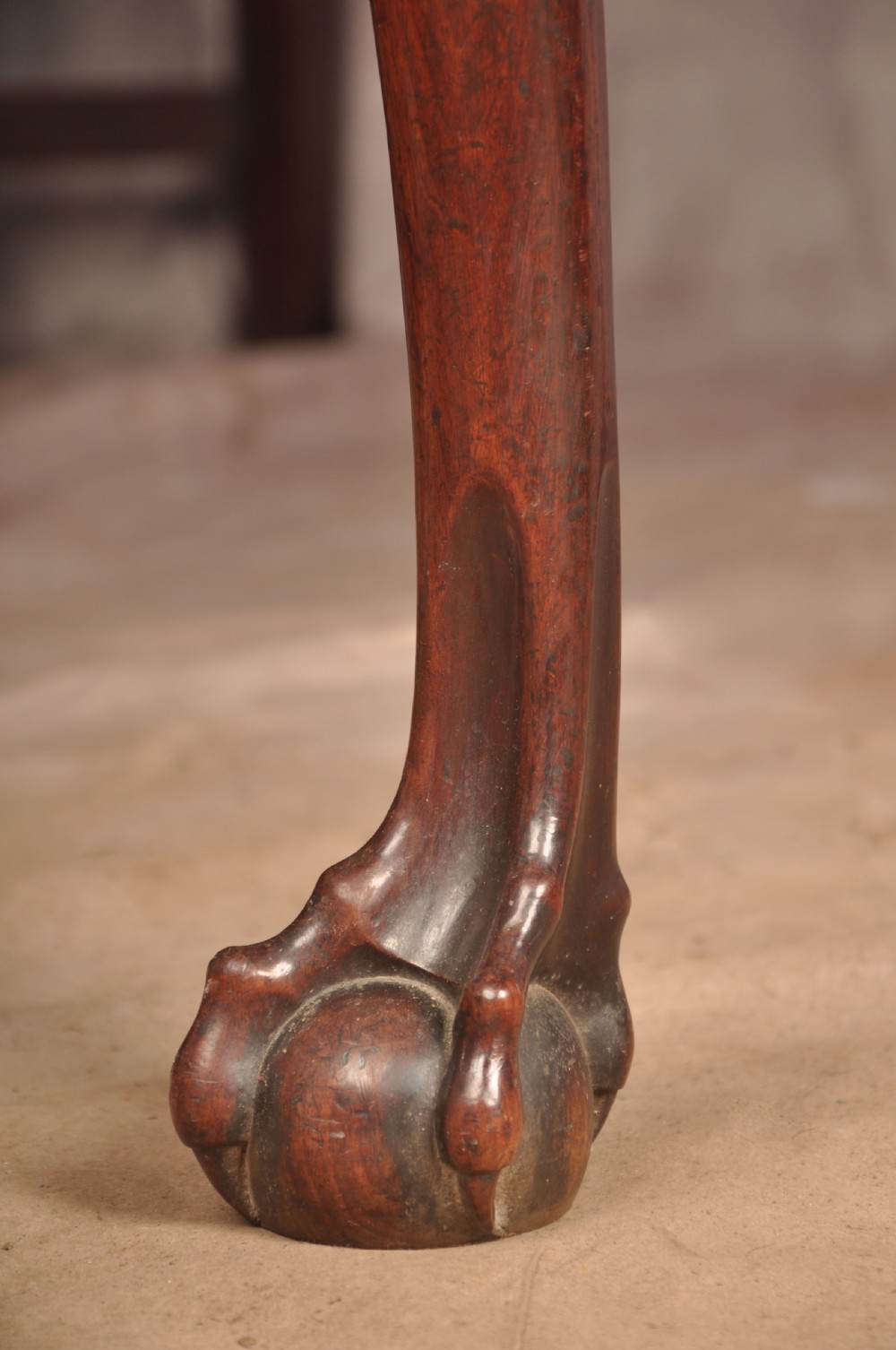 An 18th-century George II mahogany card table with a fold-over shaped top, a frieze drawer, and carved cabriole legs with claw-and-ball feet. View XVII