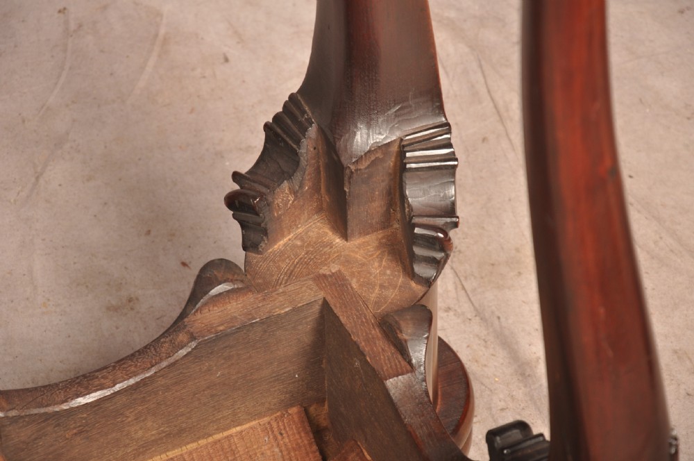 An 18th-century George II mahogany card table with a fold-over shaped top, a frieze drawer, and carved cabriole legs with claw-and-ball feet. View XIX