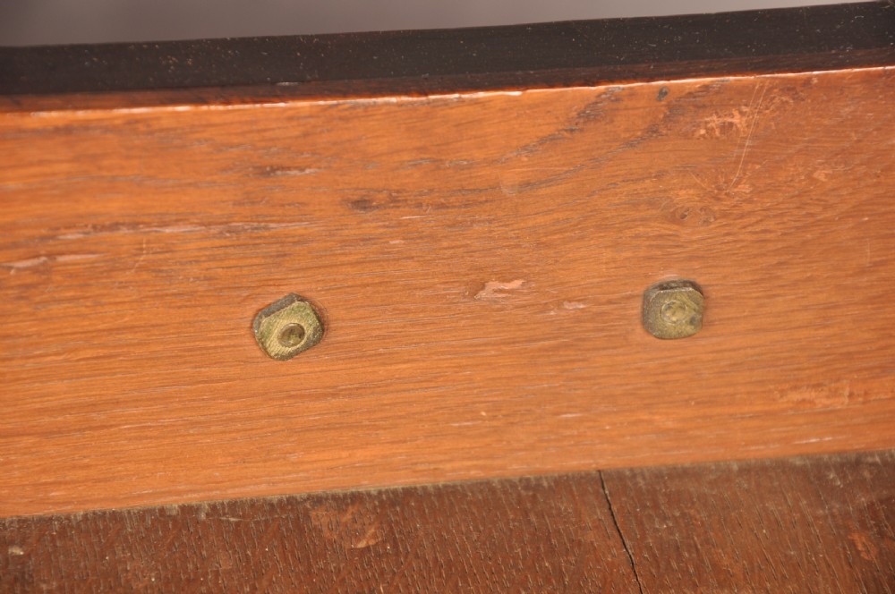 An early eighteenth-century mahogany chest of drawers featuring four graduated drawers, brass handles, a brushing slide, and bracket feet. View IX
