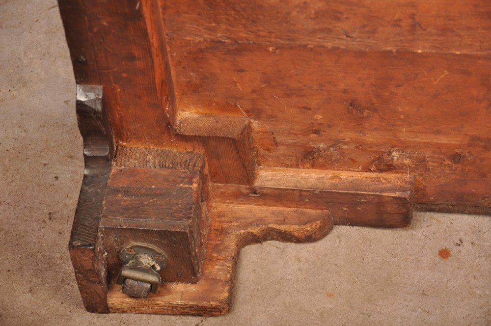 An early eighteenth-century mahogany chest of drawers featuring four graduated drawers, brass handles, a brushing slide, and bracket feet. View XIX