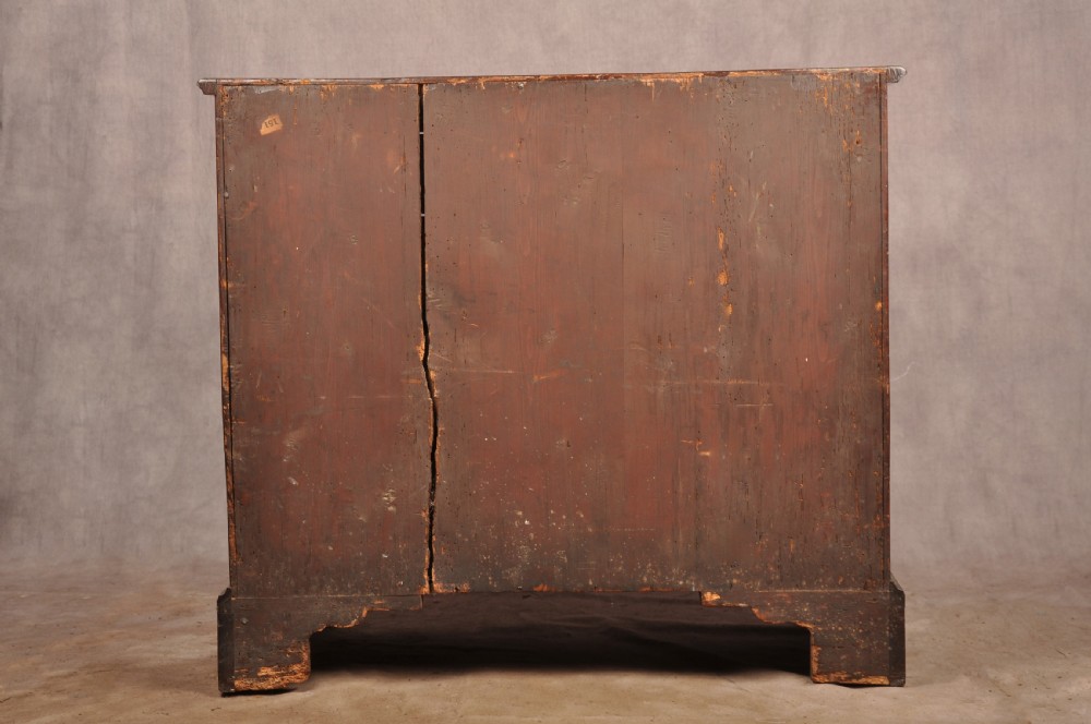 An early eighteenth-century mahogany chest of drawers featuring four graduated drawers, brass handles, a brushing slide, and bracket feet. View XXI