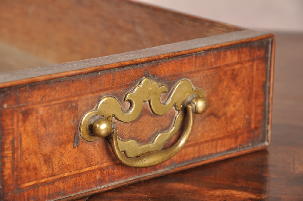 An 18th-century George II walnut lowboy side table featuring three drawers with brass handles, a shaped kneehole apron, and cabriole legs on pad feet. View VI