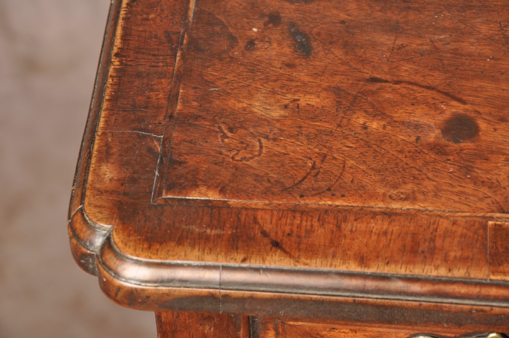 An 18th-century George II walnut lowboy side table featuring three drawers with brass handles, a shaped kneehole apron, and cabriole legs on pad feet. View IX