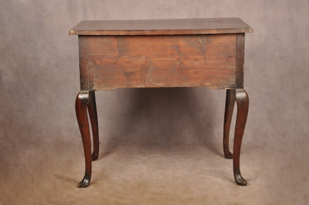 An 18th-century George II walnut lowboy side table featuring three drawers with brass handles, a shaped kneehole apron, and cabriole legs on pad feet. View XIV