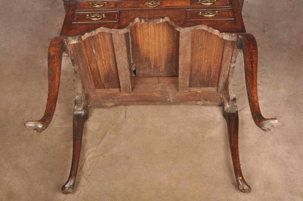 An 18th-century George II walnut lowboy side table featuring three drawers with brass handles, a shaped kneehole apron, and cabriole legs on pad feet. View XV