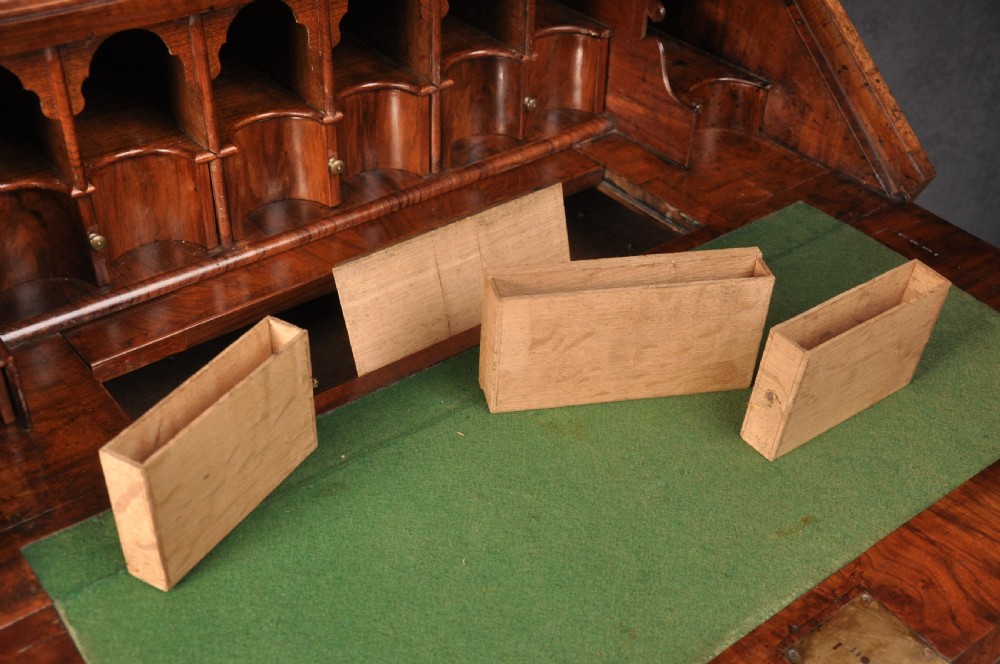 A 17th-century burr walnut bureau cabinet featuring double arched mirrored doors above a slant-front writing desk and drawers on compressed bun feet. View VIII