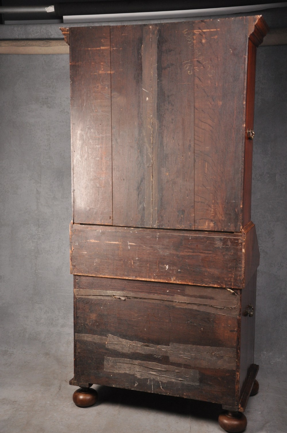 A 17th-century burr walnut bureau cabinet featuring double arched mirrored doors above a slant-front writing desk and drawers on compressed bun feet. View XVII