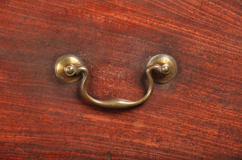 An 18th-century mahogany tallboy featuring stacked upper and lower drawer sections, brass swan-neck handles, fluted sides, and bracket feet. View II