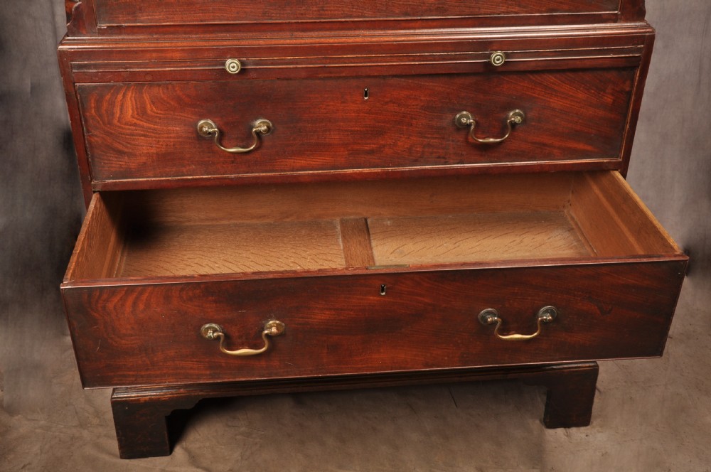 An 18th-century mahogany tallboy featuring stacked upper and lower drawer sections, brass swan-neck handles, fluted sides, and bracket feet. View VII
