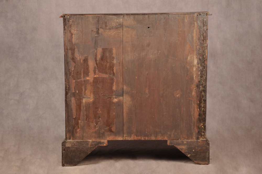 An eighteenth-century Georgian mahogany chest of drawers featuring four graduated drawers with brass swan-neck handles and bracket feet. View X