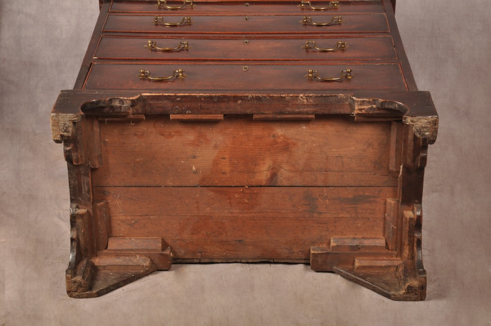 An eighteenth-century Georgian mahogany chest of drawers featuring four graduated drawers with brass swan-neck handles and bracket feet. View XI