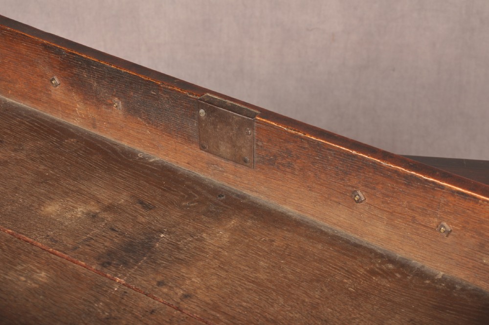 An eighteenth-century Georgian mahogany chest of drawers featuring four graduated drawers with brass swan-neck handles and bracket feet. View XIII