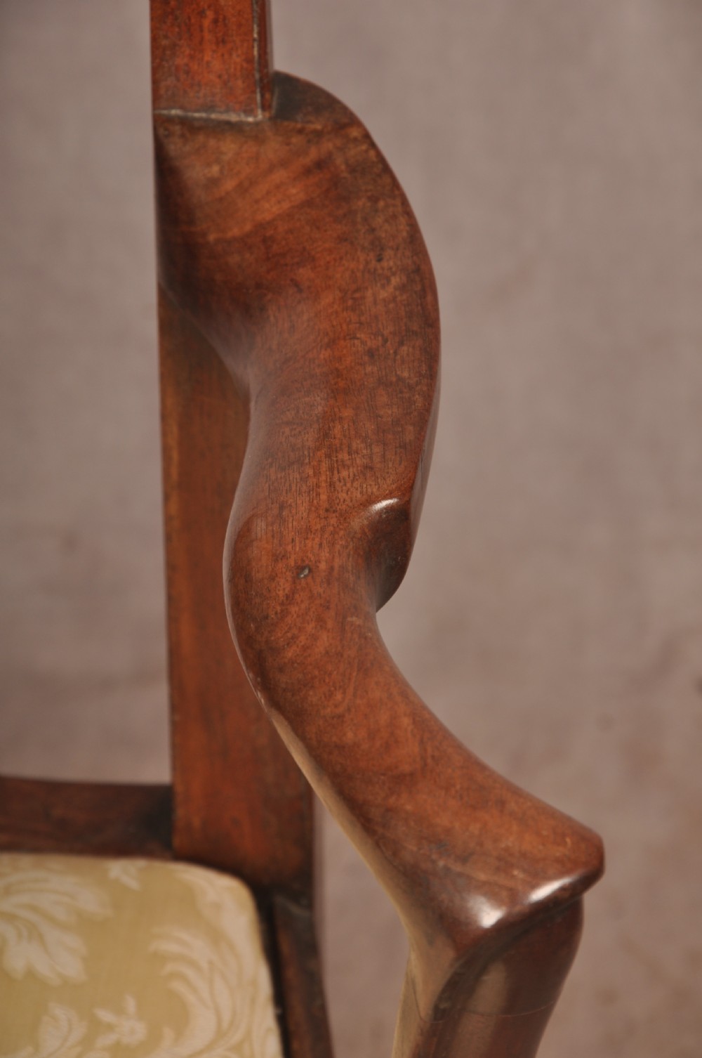 A George II mahogany armchair featuring a pierced back splat, swept armrests, a cream fabric seat, and cabriole front legs. View VII