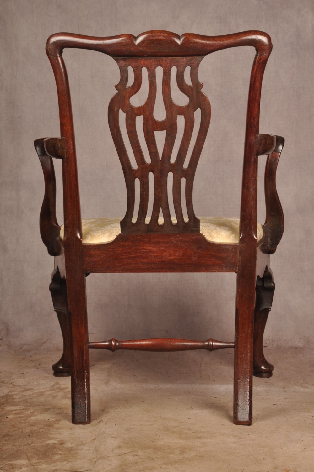 A George II mahogany armchair featuring a pierced back splat, swept armrests, a cream fabric seat, and cabriole front legs. View XI