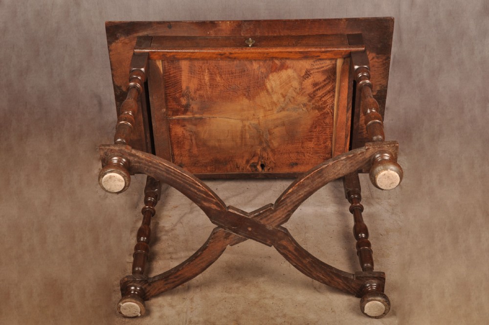 A 17th-century oak side table featuring baluster-turned legs, a shaped X-stretcher, a single frieze drawer with a brass drop handle, and a rectangular timber top. View XIII
