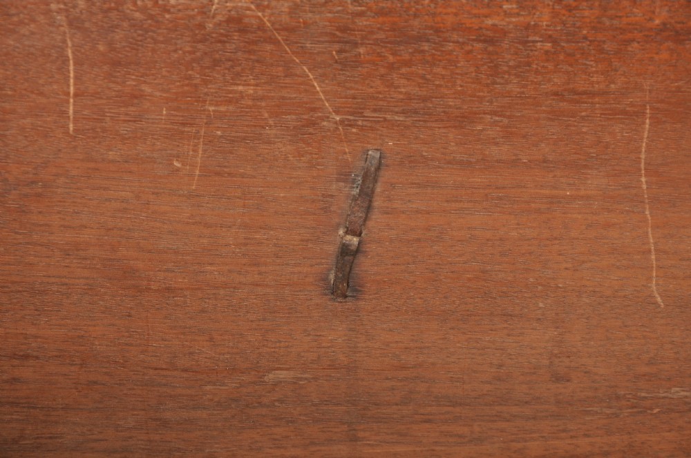 A 17th-century Charles II walnut and fruitwood chest of drawers featuring geometric mitred panels and brass keyhole escutcheons. View XIII