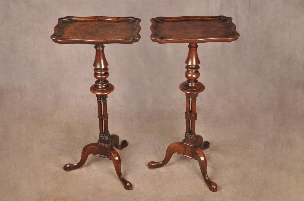 A pair of dark rosewood pedestal stands featuring turned baluster shafts, shaped tops, and tripod bases with pad feet. View II