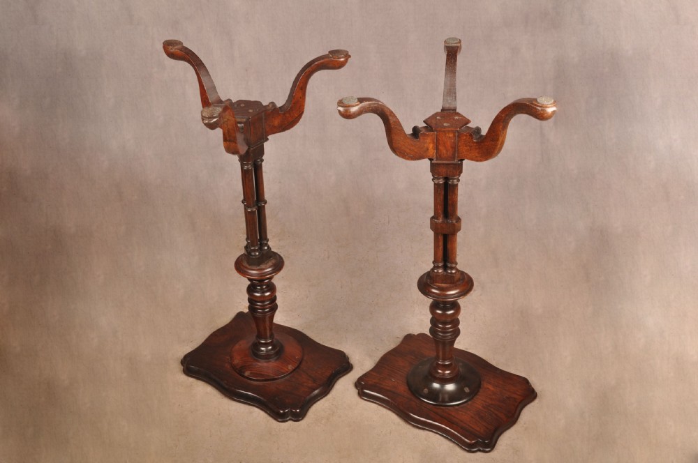 A pair of dark rosewood pedestal stands featuring turned baluster shafts, shaped tops, and tripod bases with pad feet. View VIII