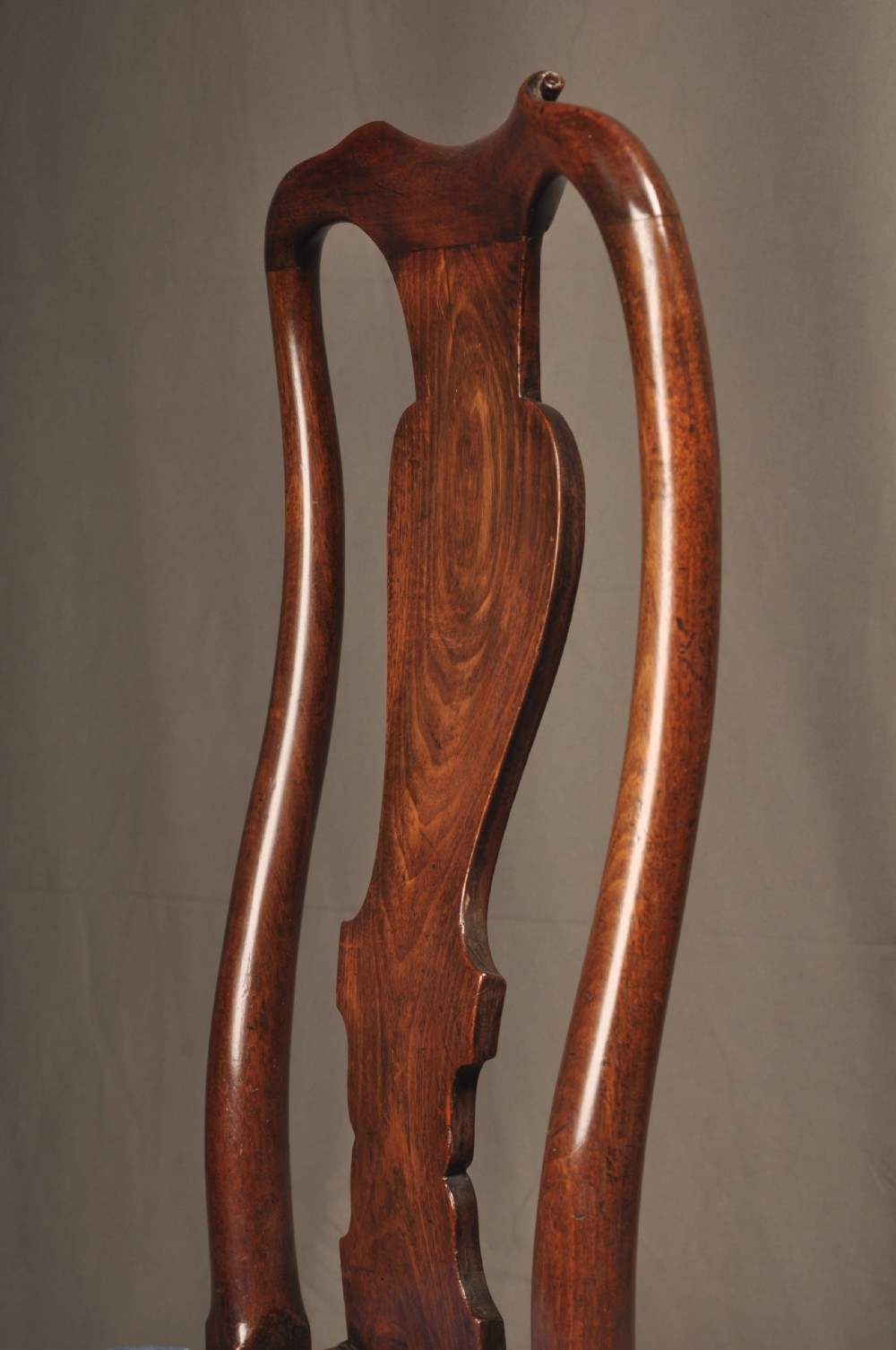 A pair of George I mahogany side chairs featuring vase-shaped back splats, blue patterned drop-in seats, and cabriole front legs. View IV