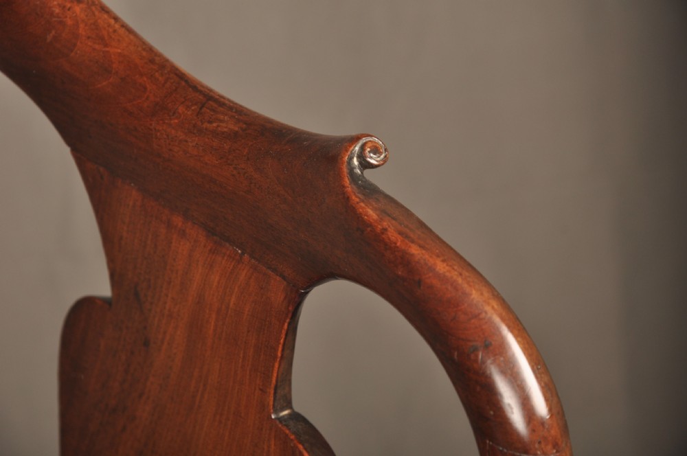 A pair of George I mahogany side chairs featuring vase-shaped back splats, blue patterned drop-in seats, and cabriole front legs. View V