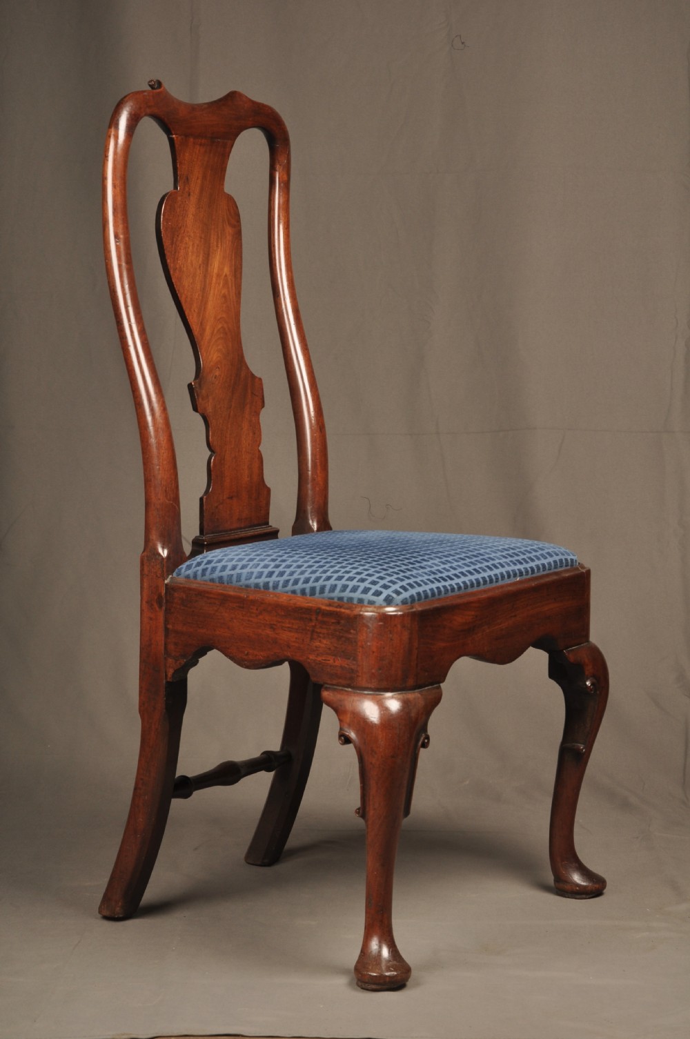 A pair of George I mahogany side chairs featuring vase-shaped back splats, blue patterned drop-in seats, and cabriole front legs. View VIII