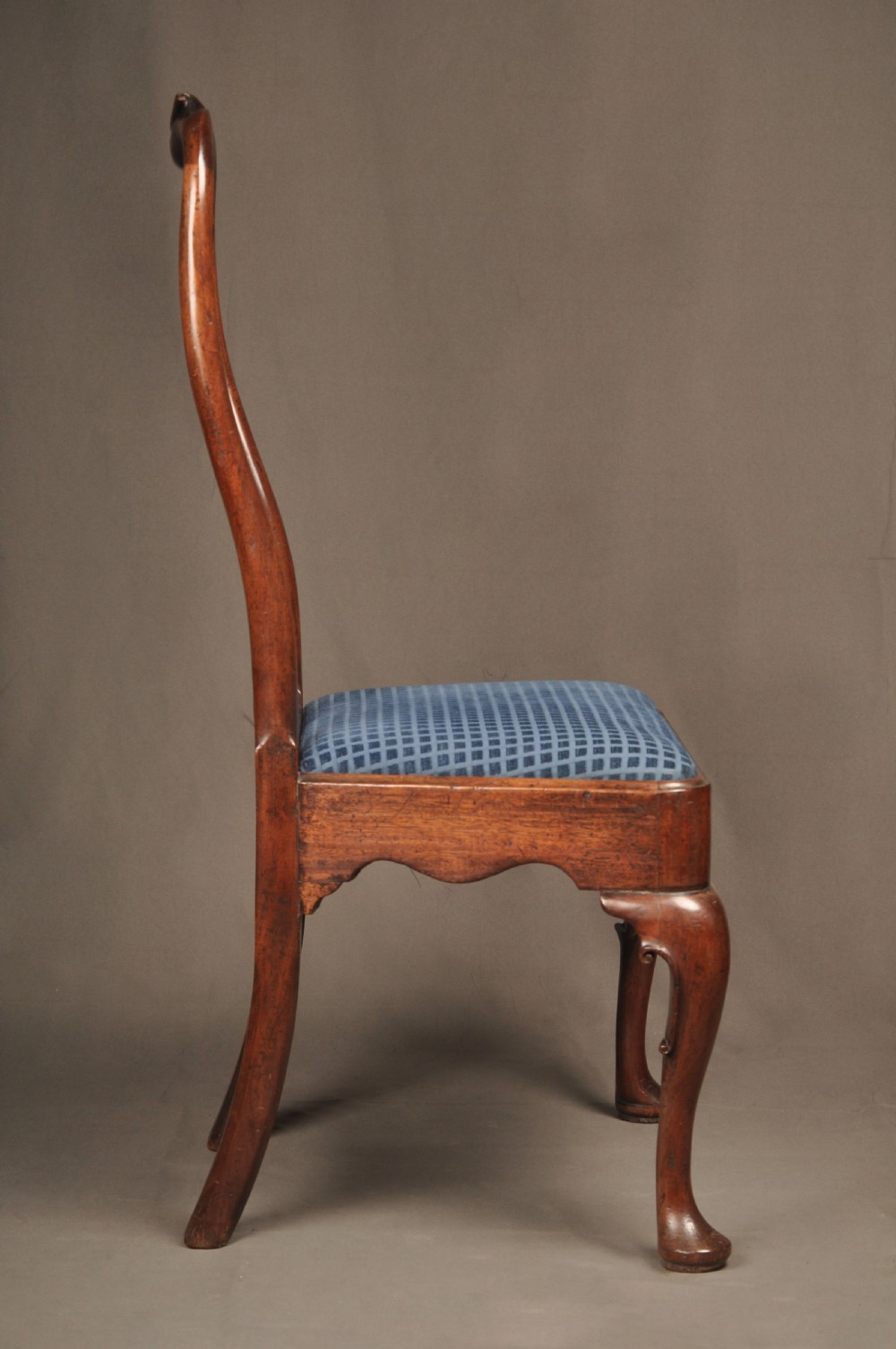 A pair of George I mahogany side chairs featuring vase-shaped back splats, blue patterned drop-in seats, and cabriole front legs. View IX