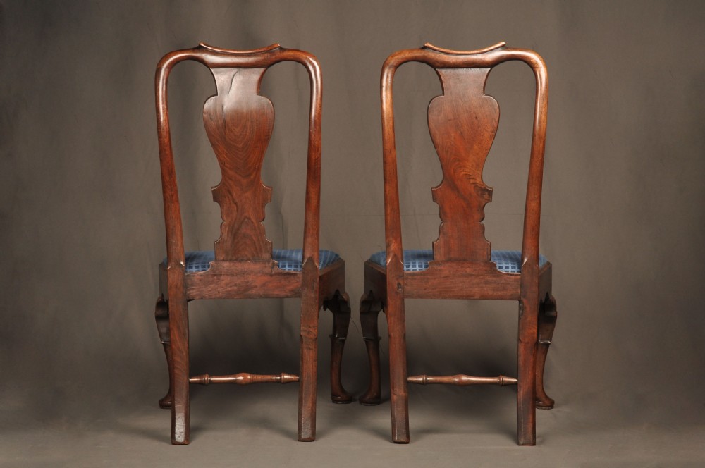 A pair of George I mahogany side chairs featuring vase-shaped back splats, blue patterned drop-in seats, and cabriole front legs. View XI
