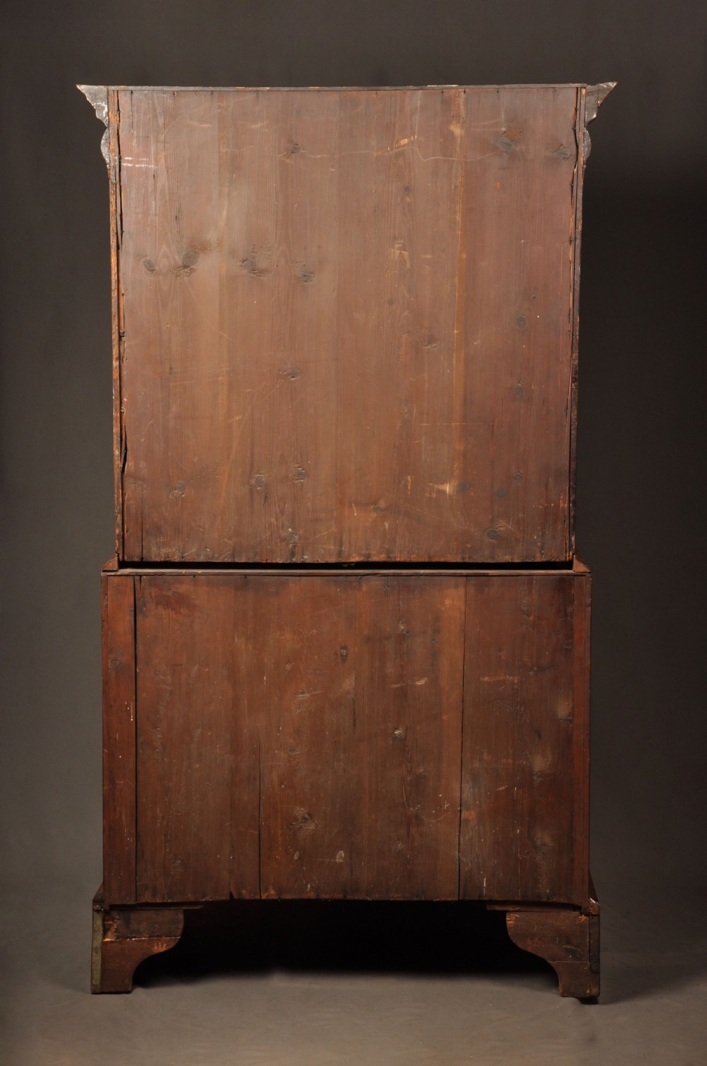 A tall Queen Anne walnut chest on chest featuring two stacked sections of drawers with brass handles and bracket feet. View XIII