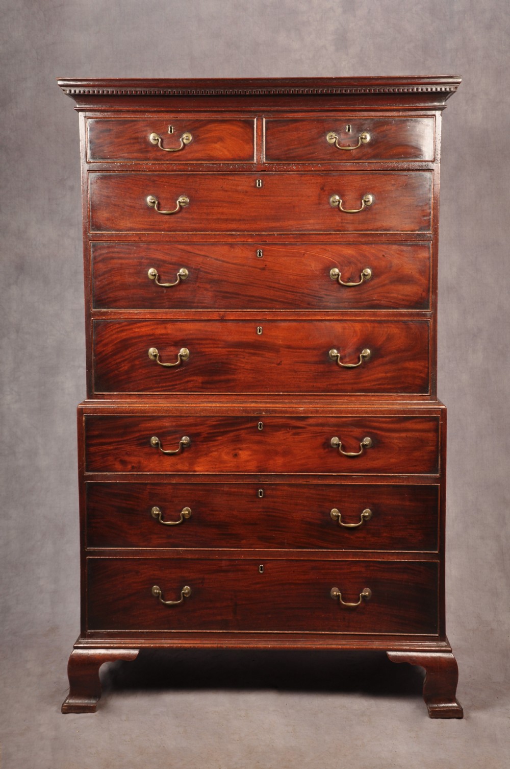 An 18th-century Georgian mahogany chest-on-chest featuring a two-part construction with brass swan-neck handles and bracket feet. View III