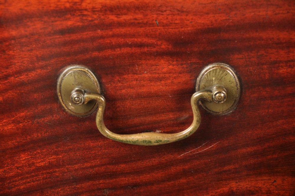 An 18th-century Georgian mahogany chest-on-chest featuring a two-part construction with brass swan-neck handles and bracket feet. View IV
