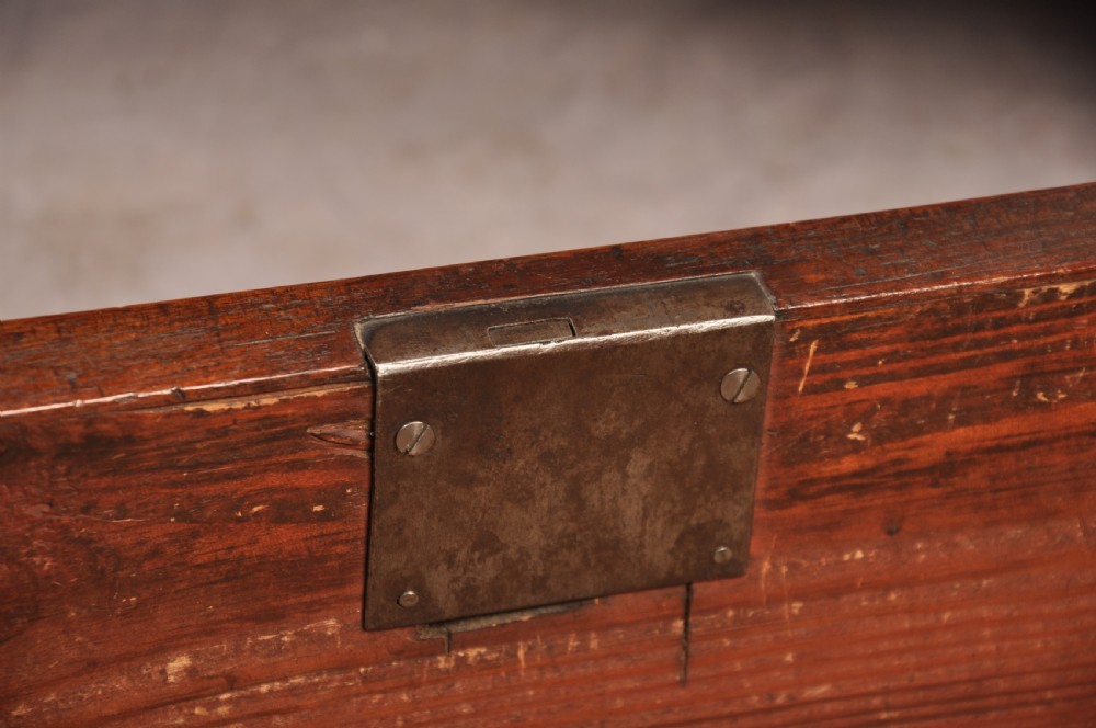 An 18th-century Georgian mahogany chest-on-chest featuring a two-part construction with brass swan-neck handles and bracket feet. View X