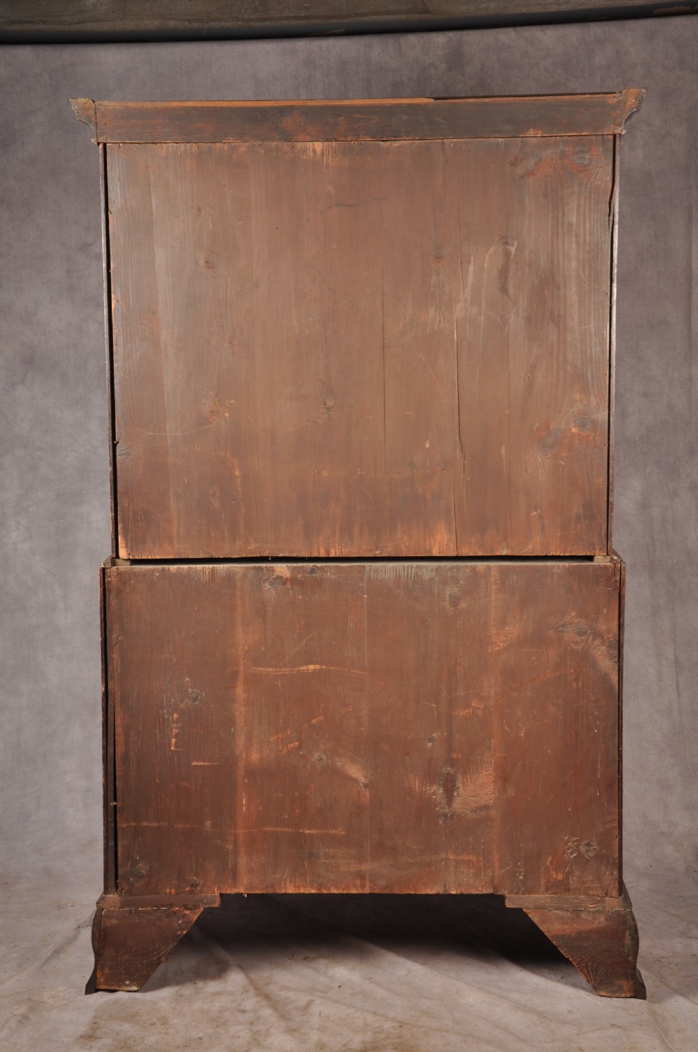 An 18th-century Georgian mahogany chest-on-chest featuring a two-part construction with brass swan-neck handles and bracket feet. View XIV
