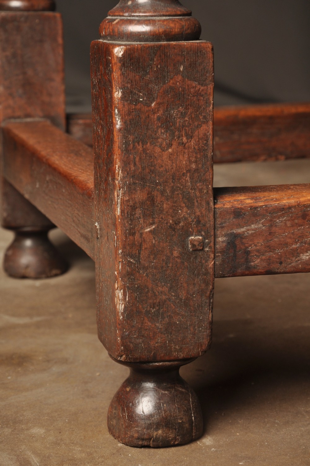 A large 17th-century solid oak gateleg dining table featuring drop leaves, turned legs, and perimeter stretchers. View VIII